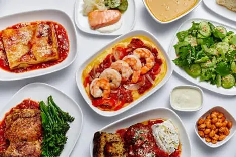an amazing feast with shrimps, lasagnas and more