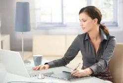 a woman working in her notebook